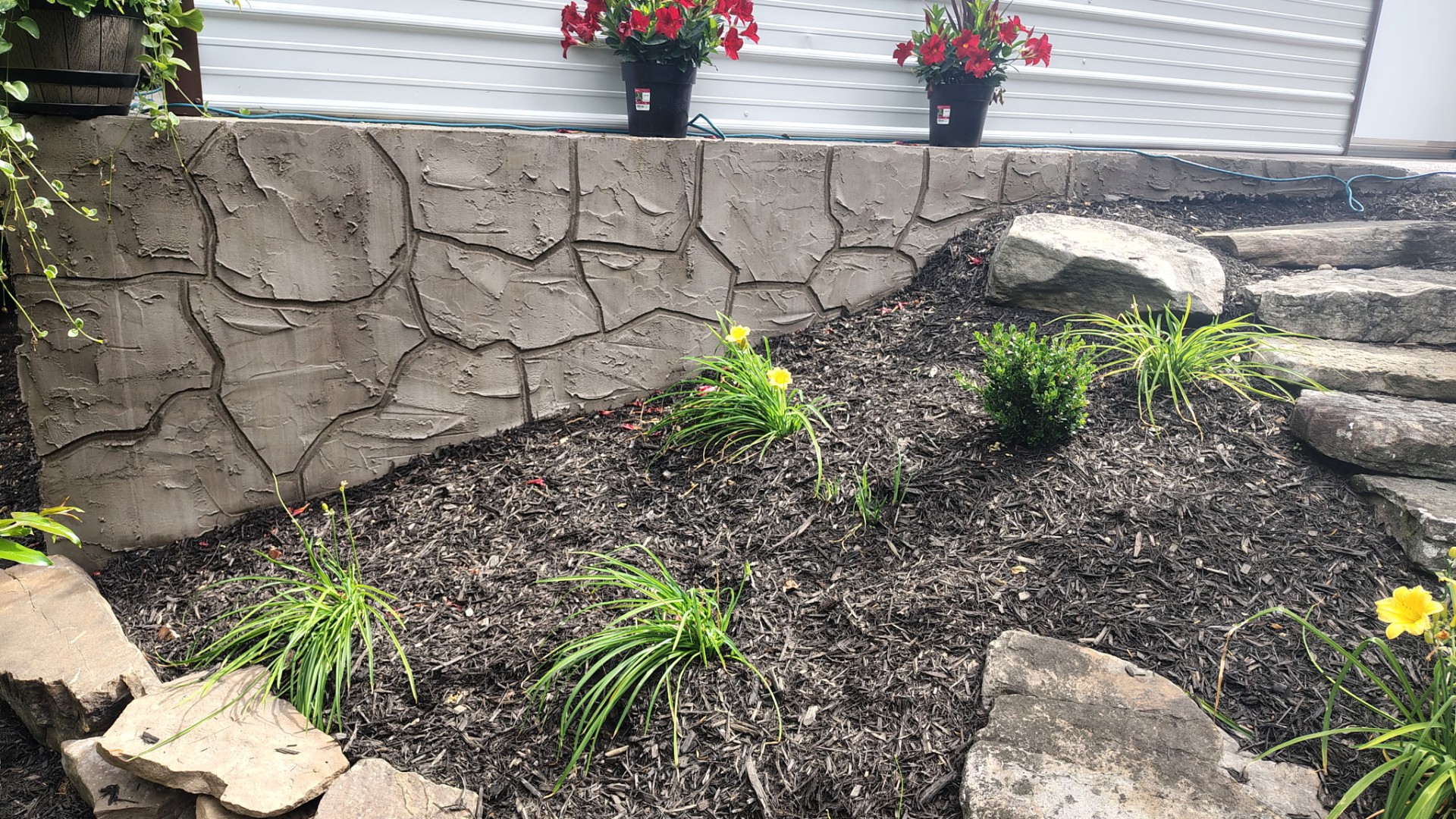 Stone-pattern stucco with landscaping